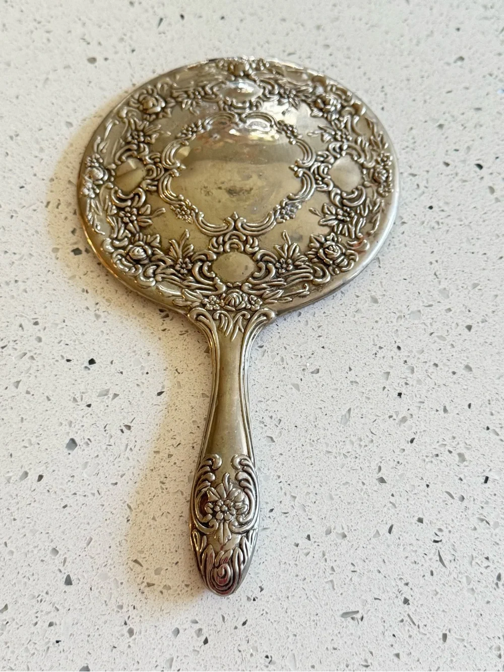 vintage silver-plated vanity hand mirror